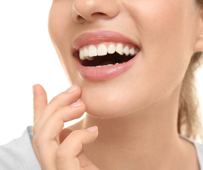Close-up image of a confident smile showcasing strong, natural-looking teeth supported by dental implants, designed to restore function, stability, and long-term oral health – dental implants